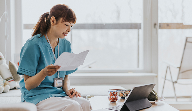 UCres-Carrot-tile-102725 Woman looking at laptop and cheering